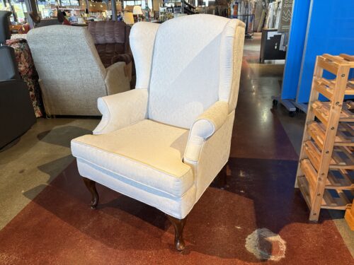 Queen Anne Style Wingback Chair with a Cream Floral Print