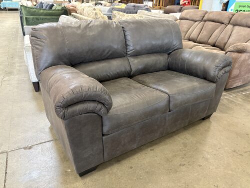 ASHLEY FURNITURE Charcoal Grey Suede-Like Loveseat with Cushioned Arms