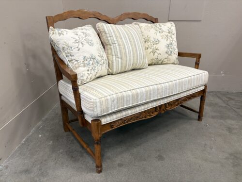 E & E CO. Vintage French Country Style Wooden Sette with Scalloped Backrest, Carved Wood Details and Neutral Patterned Cushions