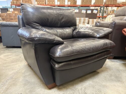 Dark Brown Leather Armchair with Plush Cushions and Wide Pillow Style Armrest