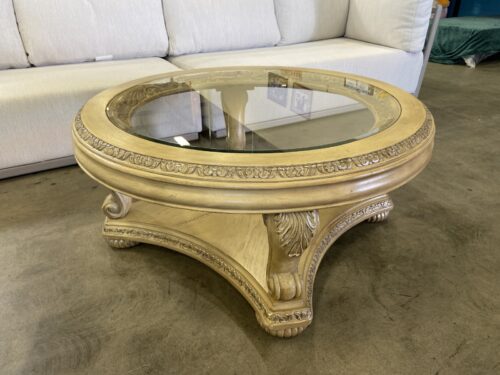 Large Round Traditional Style Coffee Table with Glass Inset Top and Ornate Carved Wood Details