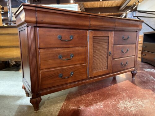Wooden Triple Dresser with Louvered Center Door and Carved Bun Feet
