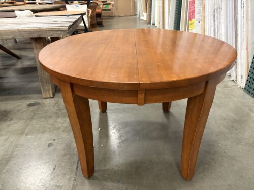 Round Cherry Finished Dining Table with Tapered Legs and Leaf Extension